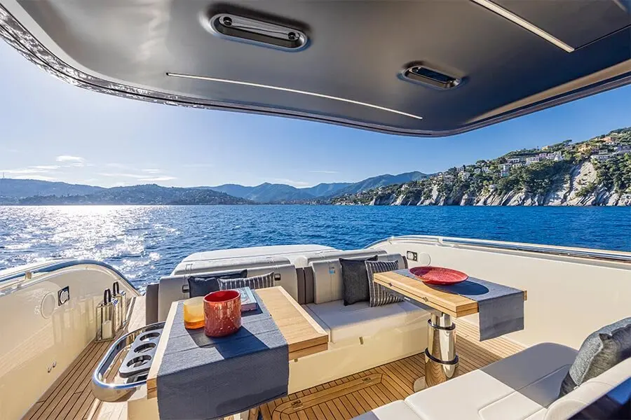 Invictus 460, aft deck — Athens Yachts Rental, Athens. Twelve guests, one Saronic coastline, all day long